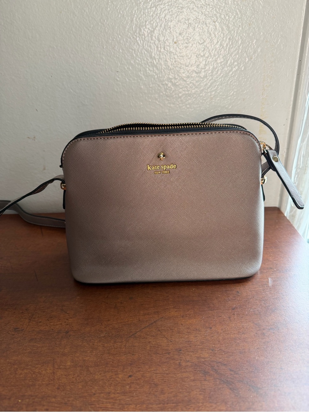 kate spade metallic taupe purse with gold logo